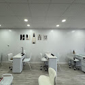 Clean white pedicure chairs inside Savannah Nails and Spa
