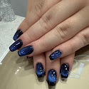 Midnight blue manicure with glitter nail art